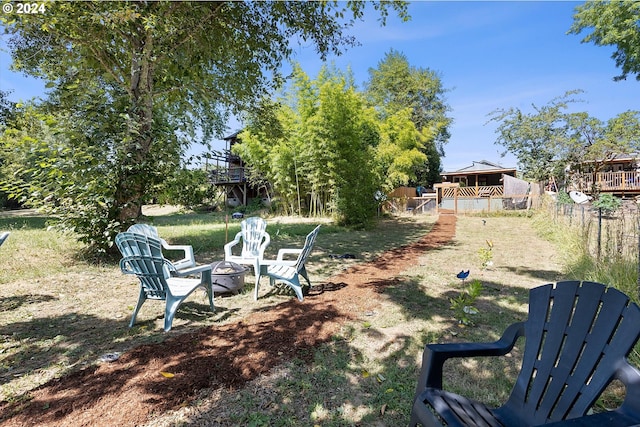 view of yard with a fire pit