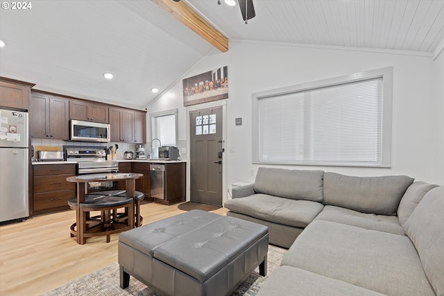 living area with lofted ceiling with beams, light wood-type flooring, ceiling fan, and recessed lighting