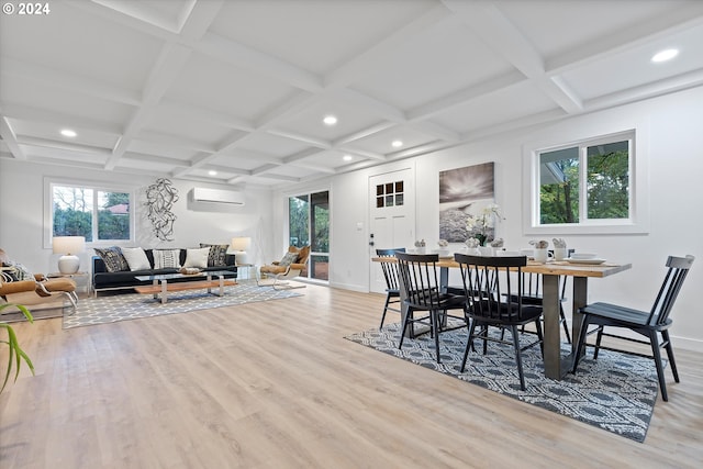 dining room with a wall mounted air conditioner, light hardwood / wood-style flooring, and coffered ceiling