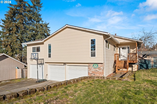 view of home's exterior with a garage and a yard