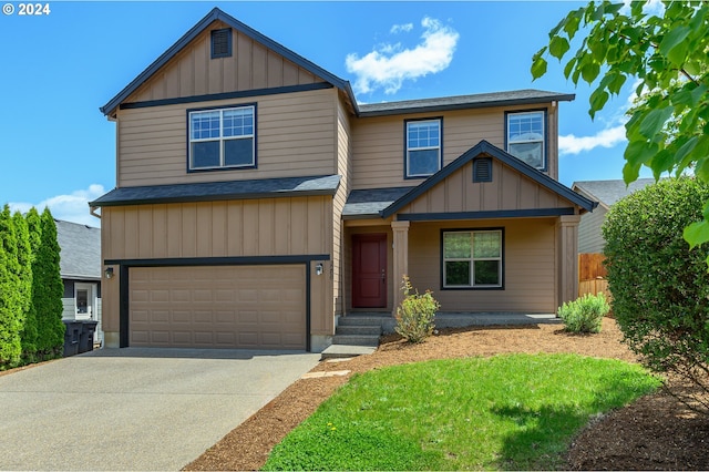 view of front of home featuring a garage and a front lawn