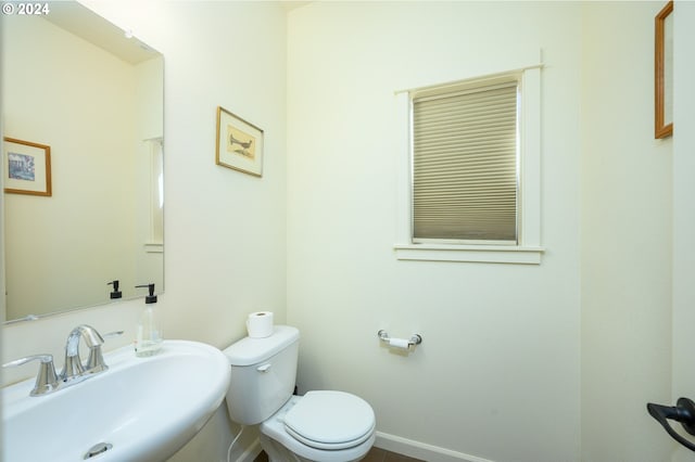 bathroom featuring sink and toilet