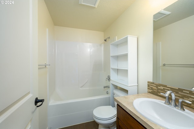 full bathroom featuring washtub / shower combination, backsplash, toilet, tile flooring, and vanity