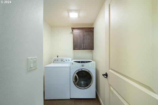 clothes washing area with cabinets, separate washer and dryer, and light tile flooring