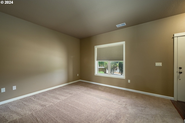 spare room with carpet floors