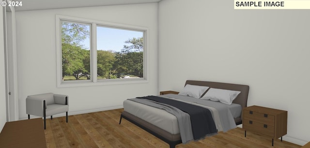 bedroom with hardwood / wood-style flooring