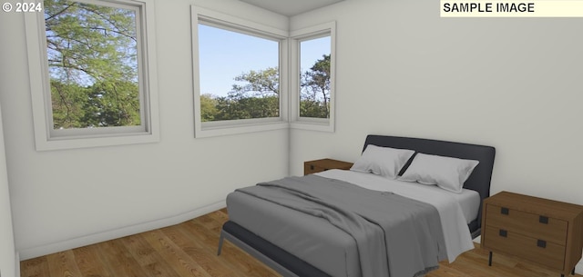 bedroom featuring hardwood / wood-style floors