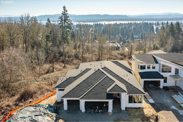 birds eye view of property with a mountain view