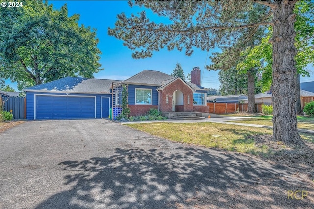 ranch-style house featuring a garage