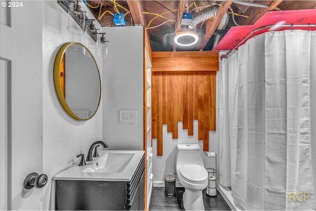 bathroom featuring vanity, hardwood / wood-style floors, walk in shower, and toilet