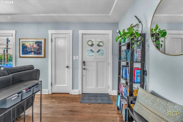 foyer with wood-type flooring