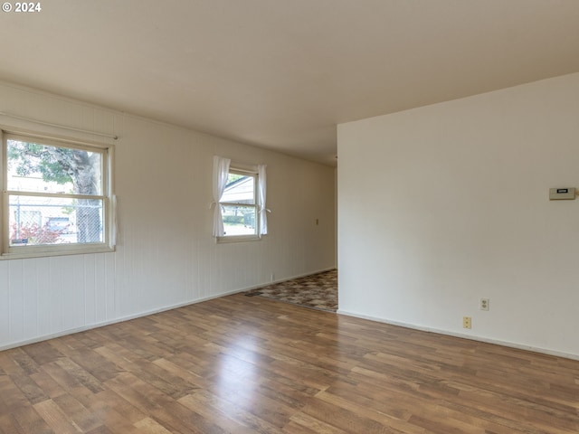 unfurnished room featuring hardwood / wood-style floors