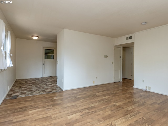 empty room with light hardwood / wood-style floors