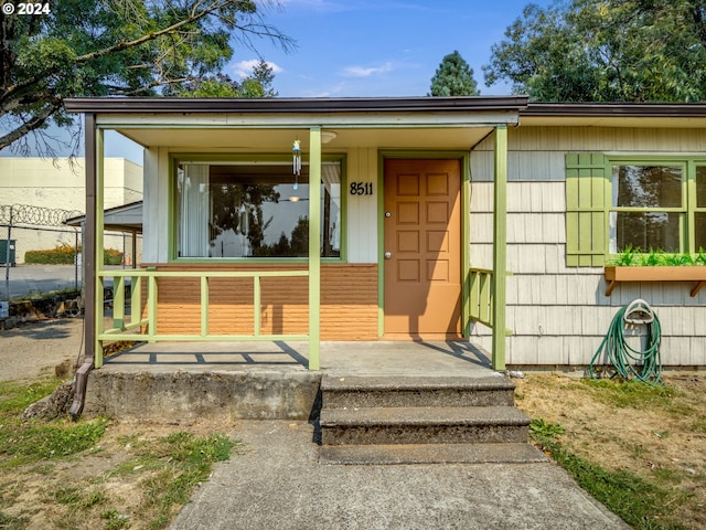 entrance to property with covered porch