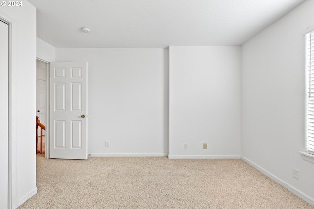 empty room with light carpet