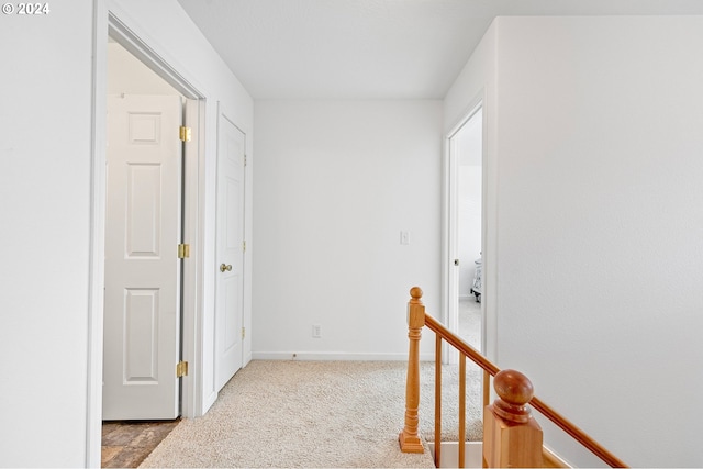 corridor with light carpet