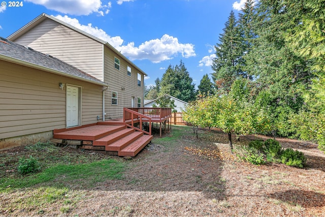 view of yard featuring a wooden deck