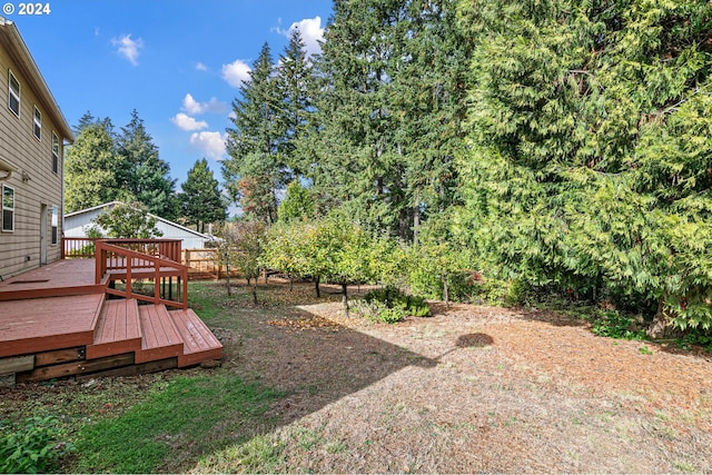 view of yard with a wooden deck