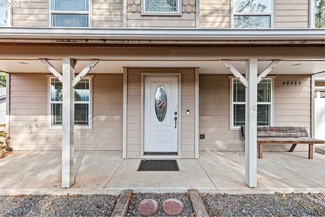 property entrance featuring covered porch