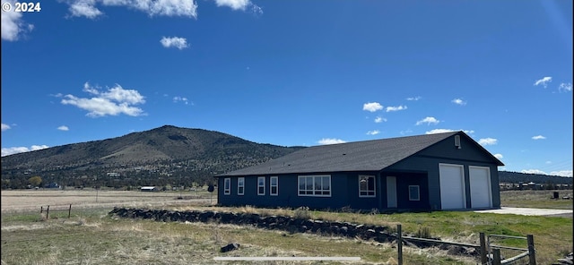 exterior space with a mountain view and a rural view