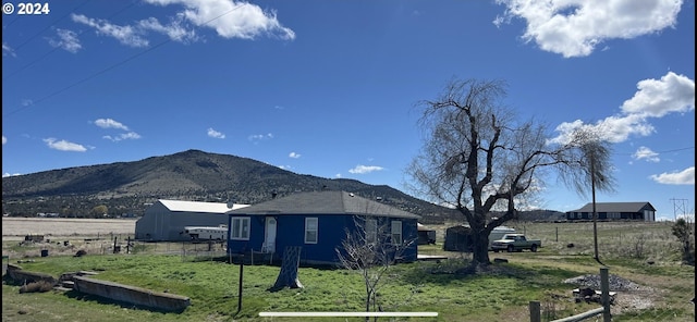 view of mountain feature with a rural view