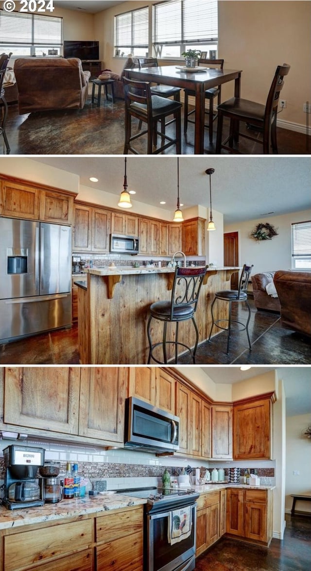 kitchen featuring pendant lighting, a breakfast bar, decorative backsplash, and stainless steel appliances