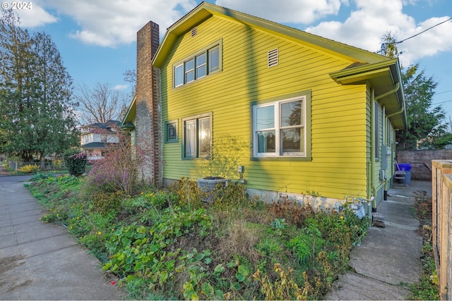 view of property exterior with central AC unit