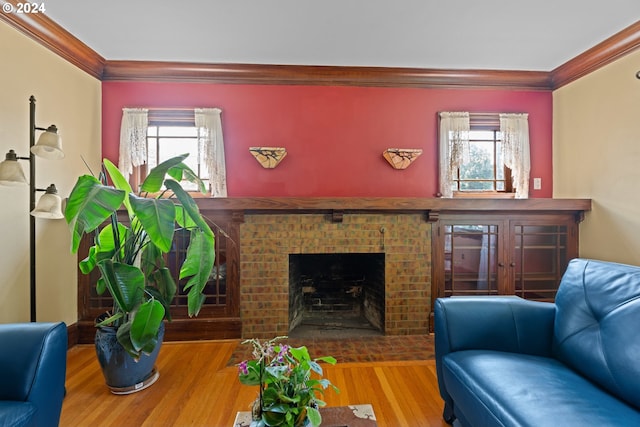 living room featuring plenty of natural light, ornamental molding, and hardwood / wood-style flooring