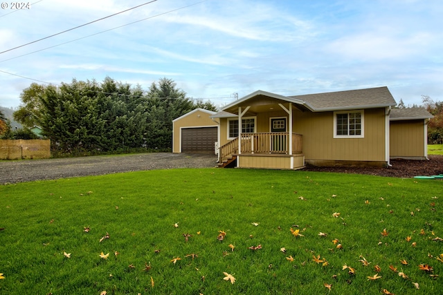 ranch-style home featuring a front yard and covered porch