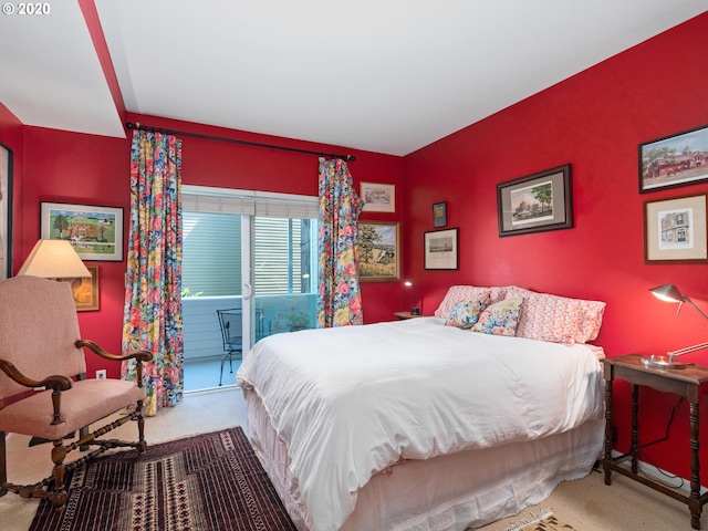 carpeted bedroom featuring access to outside