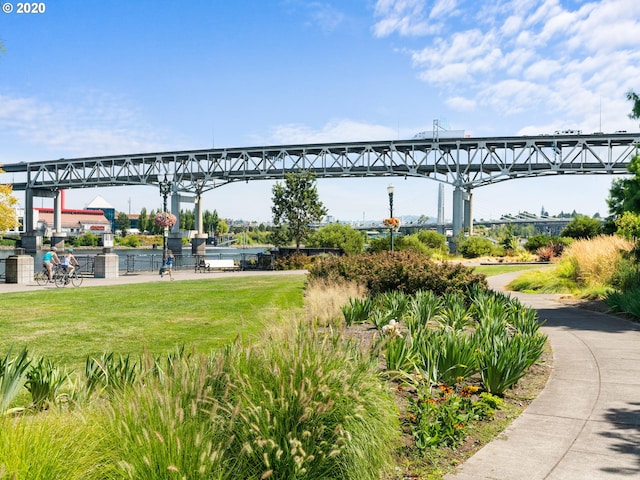 view of property's community featuring a yard