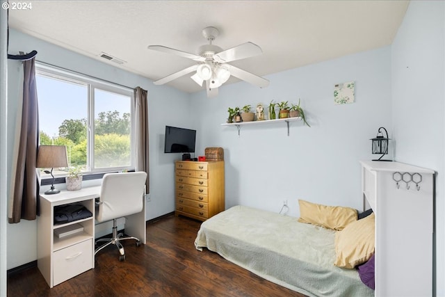 bedroom featuring ceiling fan and dark hardwood / wood-style floors