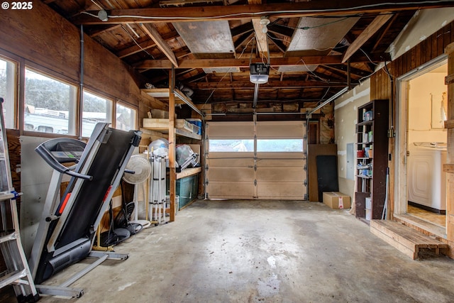 garage featuring washer / clothes dryer and a garage door opener