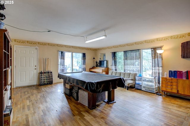 playroom with a wealth of natural light, wood-type flooring, and pool table