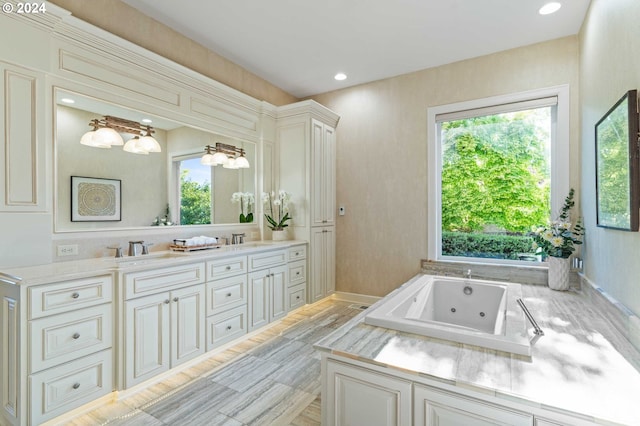 bathroom featuring a bathing tub, tile flooring, double sink, and large vanity