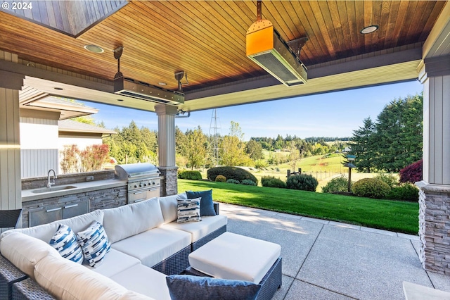 view of terrace featuring sink, an outdoor hangout area, a grill, and an outdoor kitchen