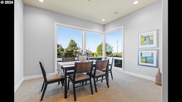 dining area with light colored carpet