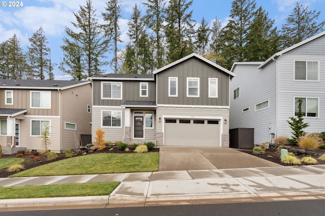 view of front facade featuring a front yard and a garage