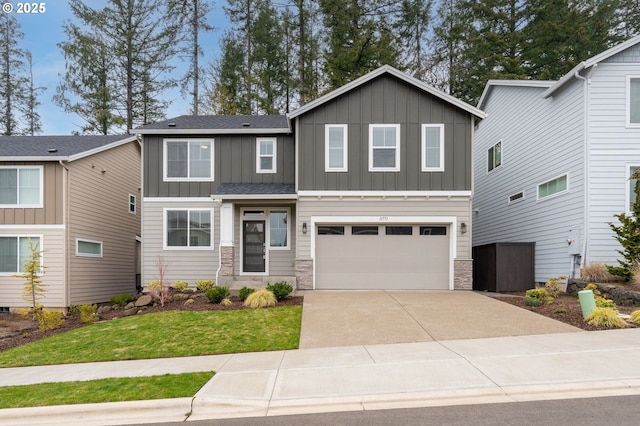 craftsman inspired home featuring stone siding, board and batten siding, concrete driveway, and an attached garage