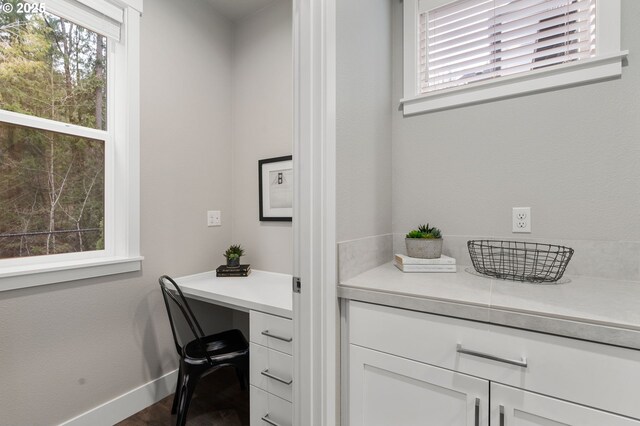 bathroom with vanity, toilet, and a shower with door