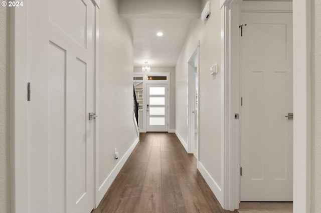 hallway featuring wood-type flooring