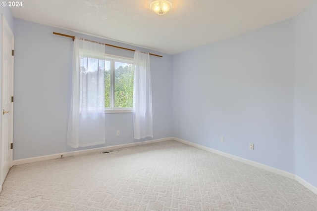 spare room featuring carpet floors