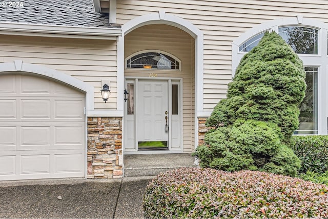 entrance to property featuring a garage