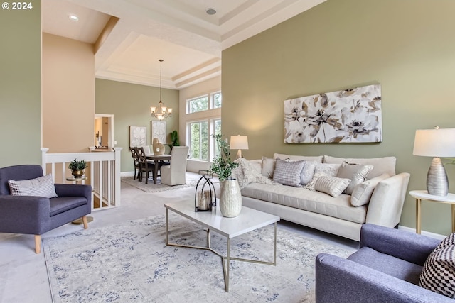 living room with light carpet and a notable chandelier