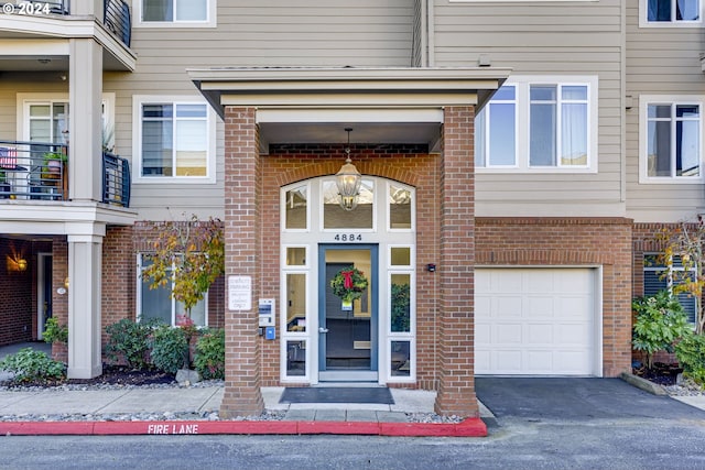 doorway to property featuring a garage