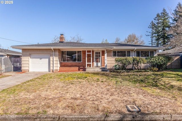 ranch-style home with driveway, a chimney, an attached garage, and fence