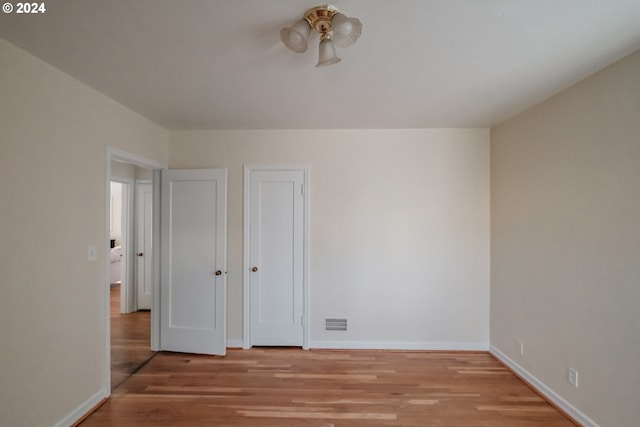 895 Hilltop Dr, Salem, OR 97304 - unfurnished bedroom with light wood-style floors and baseboards