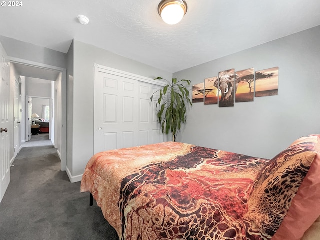 carpeted bedroom with a closet