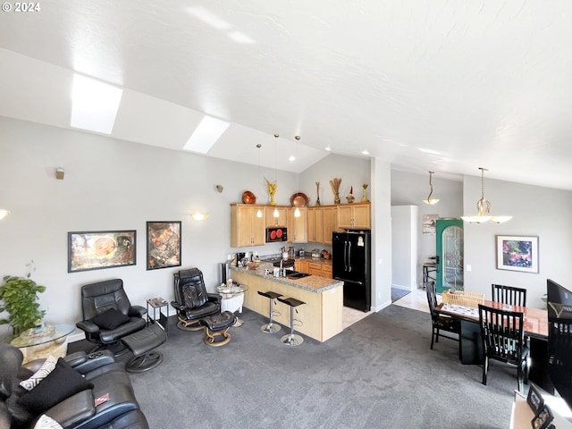 living room featuring light carpet, sink, and lofted ceiling