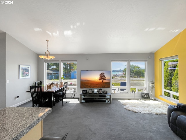 carpeted living room with lofted ceiling